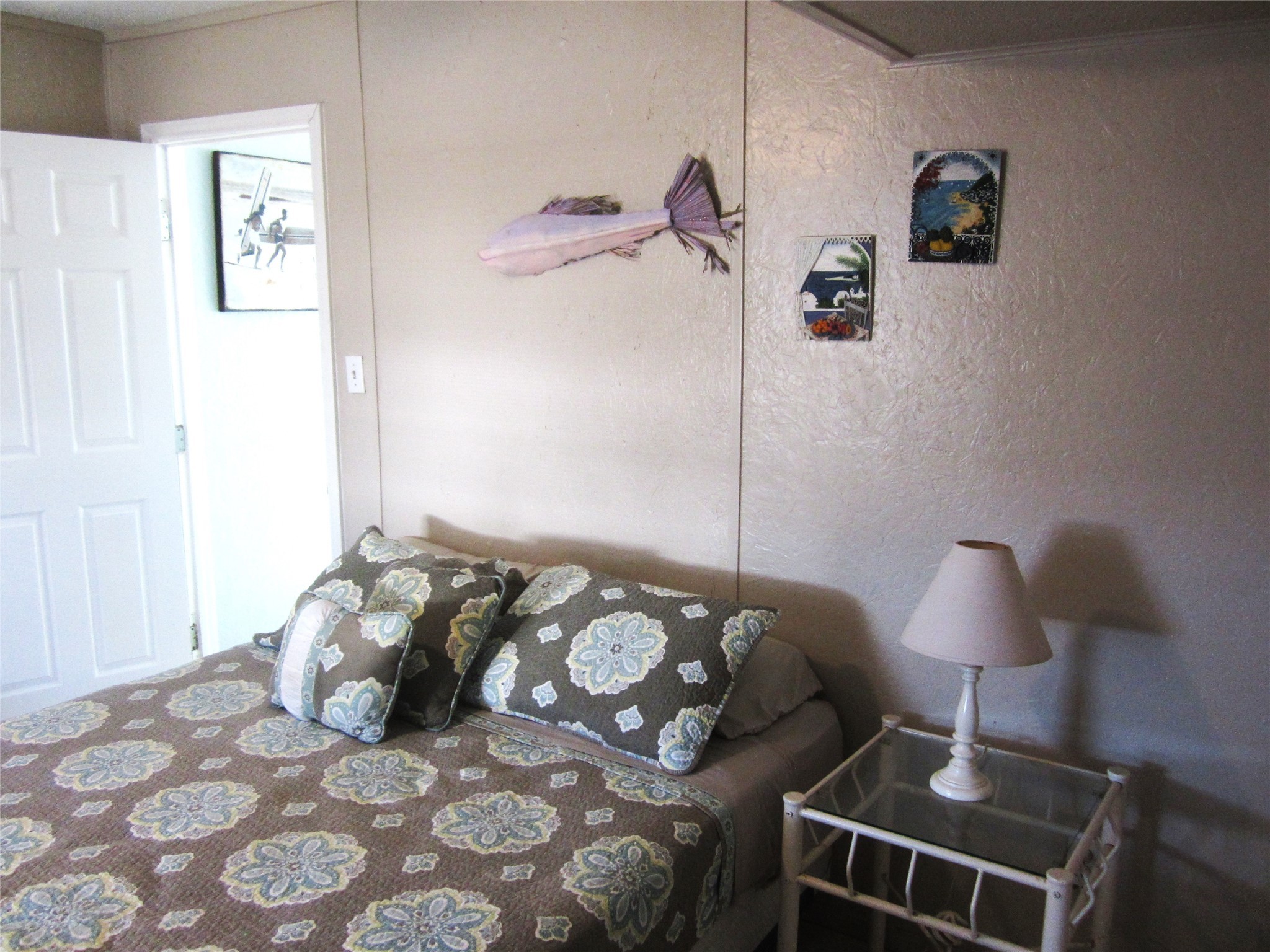 21639 Termini-San Luis Pass Road Galveston, TX 77554 - Photo 17 of 33 a bedroom with a bed and a lamp