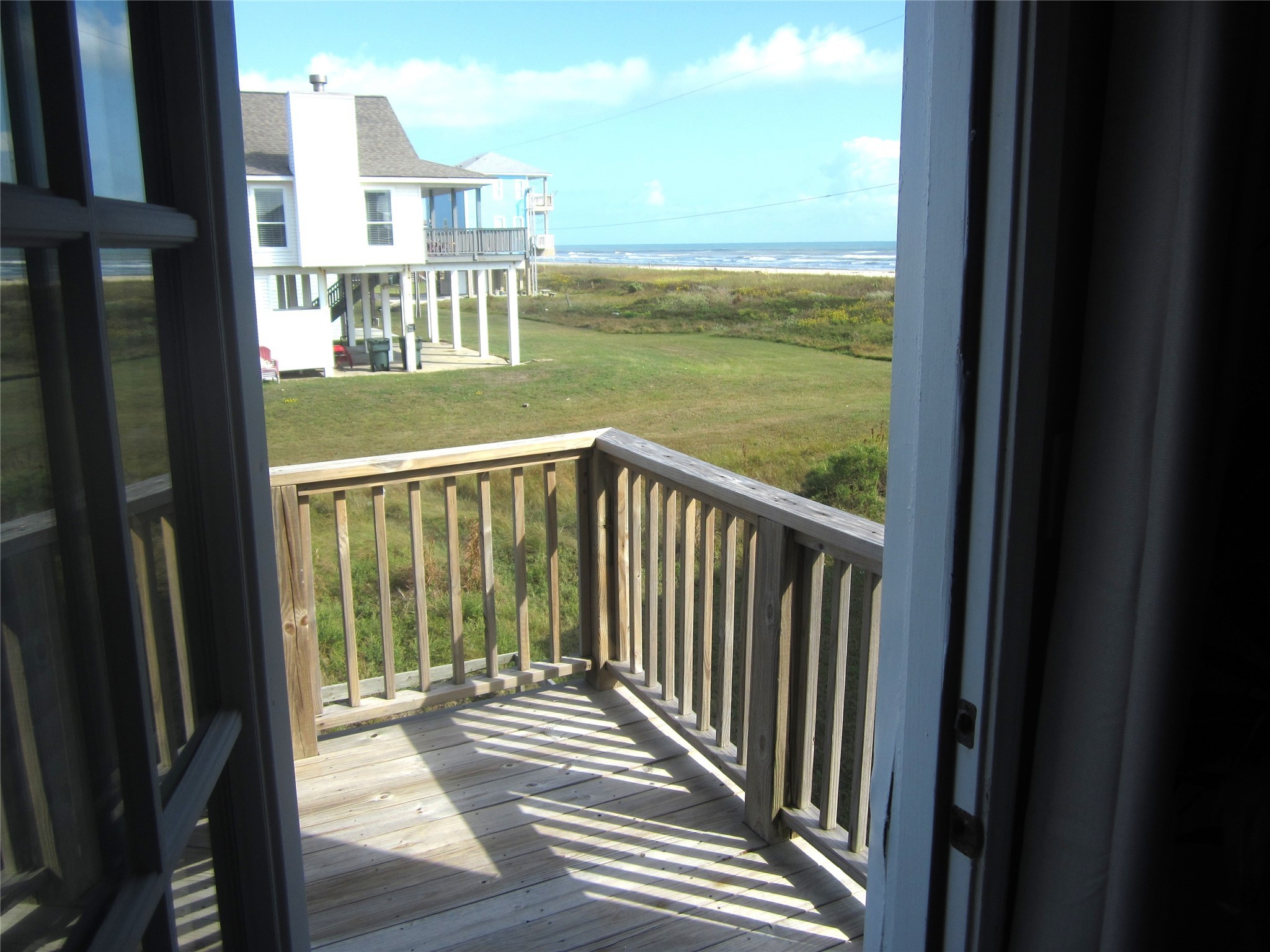 21639 Termini-San Luis Pass Road Galveston, TX 77554 - Photo 19 of 33 a view of a balcony with an ocean view