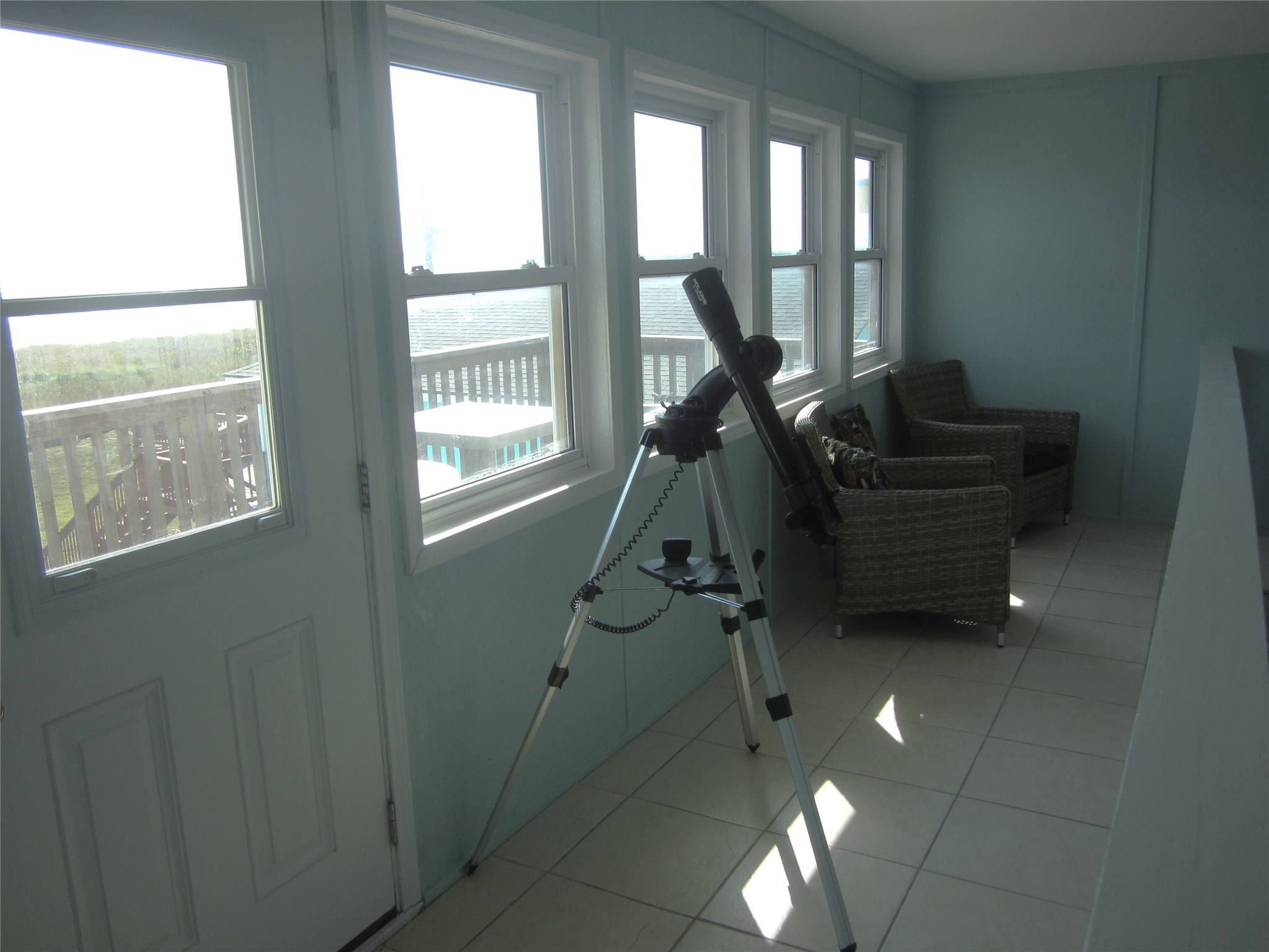 21639 Termini-San Luis Pass Road Galveston, TX 77554 - Photo 22 of 33 a room with gym equipment and a large window