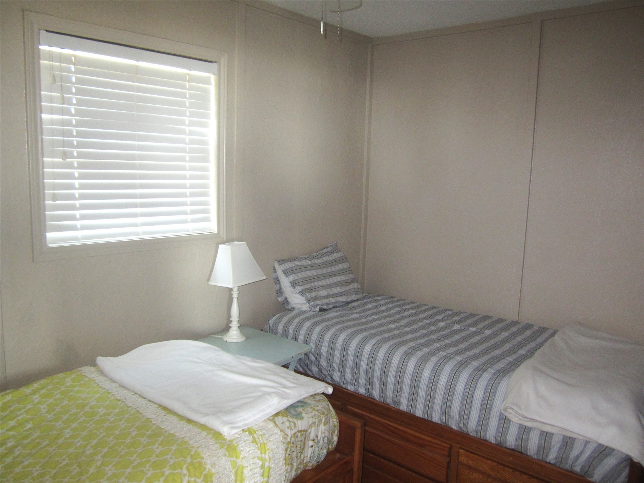 21639 Termini-San Luis Pass Road Galveston, TX 77554 - Photo 27 of 33 a bedroom with a bed and a window