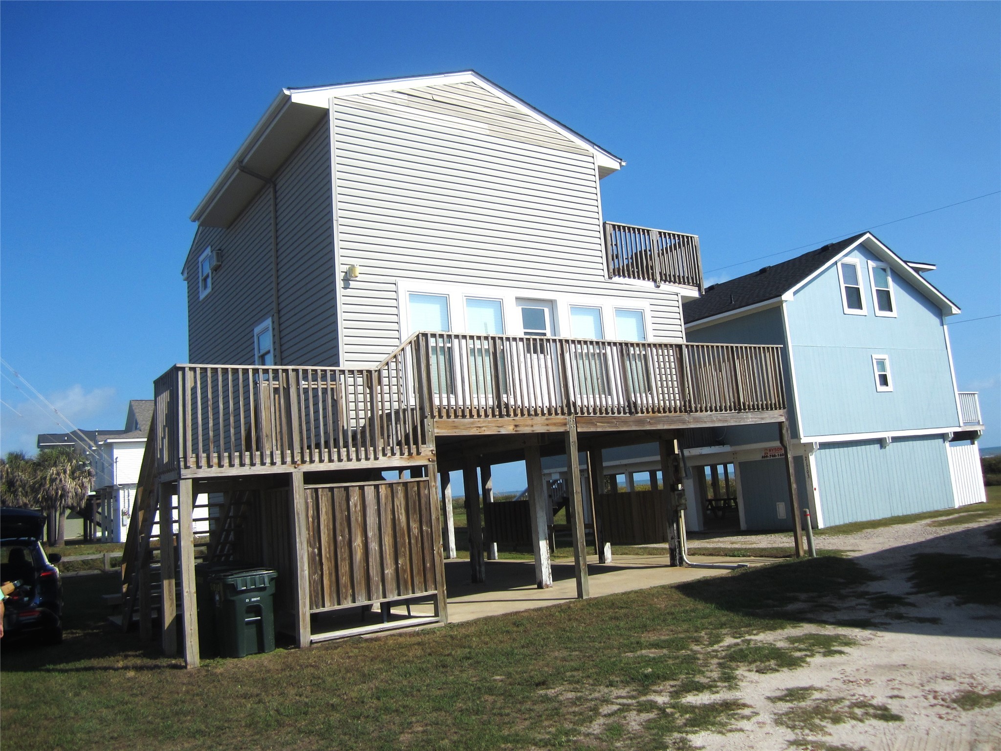 21639 Termini-San Luis Pass Road Galveston, TX 77554 - Photo 3 of 33 a front view of a house with a balcony