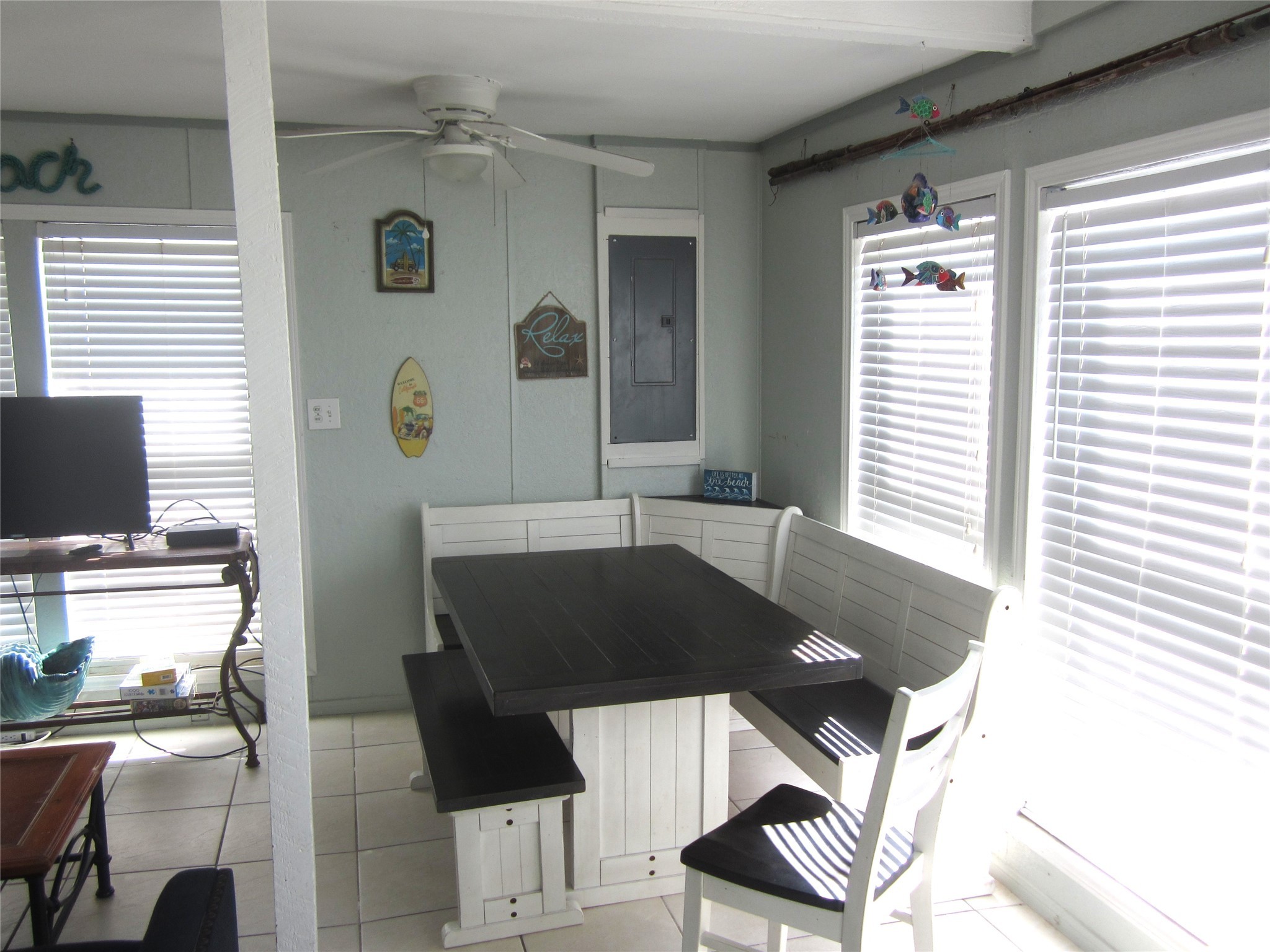 21639 Termini-San Luis Pass Road Galveston, TX 77554 - Photo 9 of 33 a living room with a couch and a flat screen tv