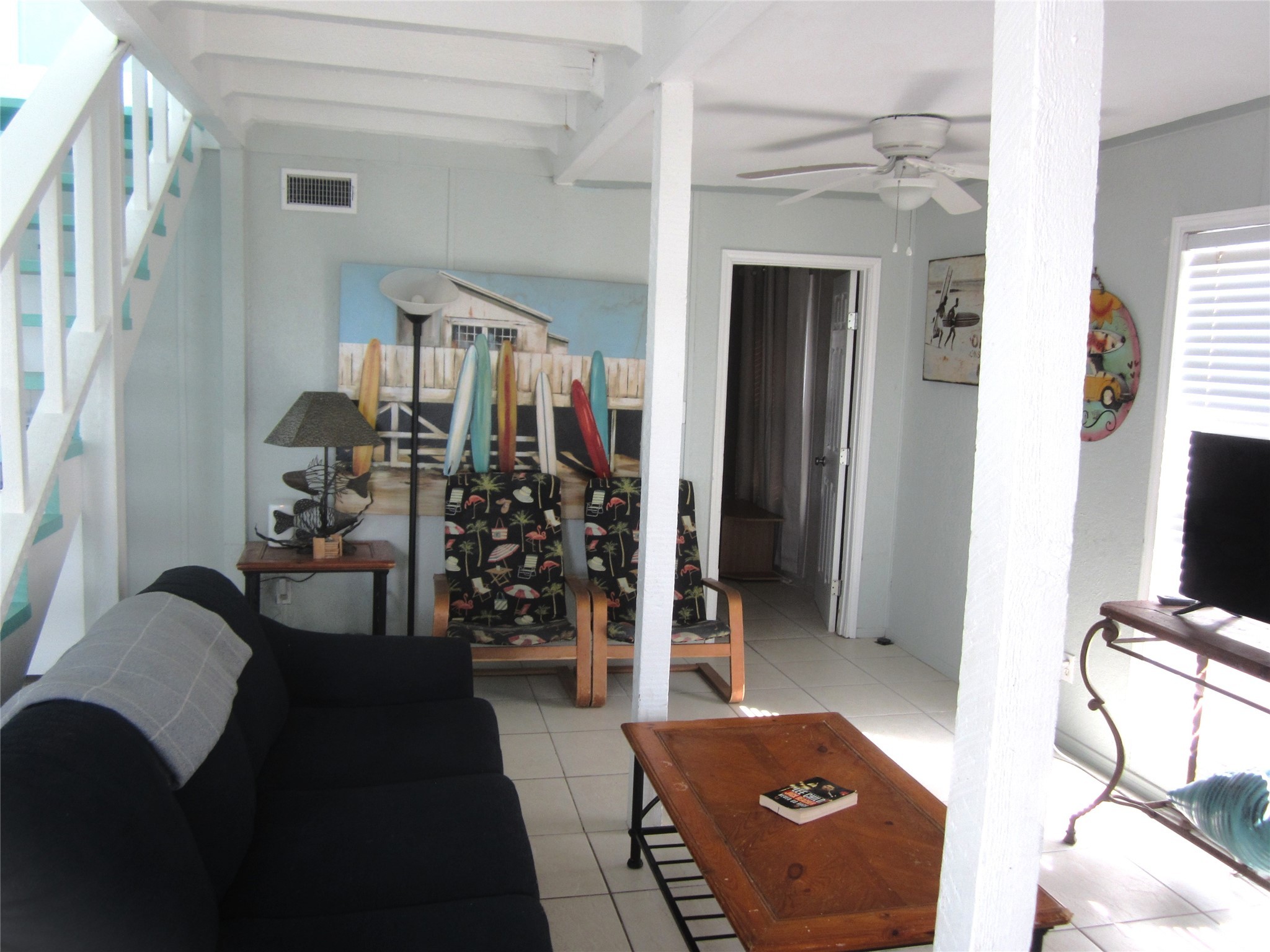 21639 Termini-San Luis Pass Road Galveston, TX 77554 - Photo 10 of 33 a living room with furniture and a flat screen tv