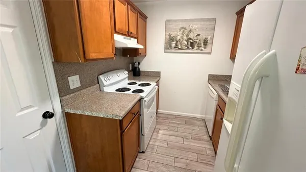 a view of a hallway with washer and dryer