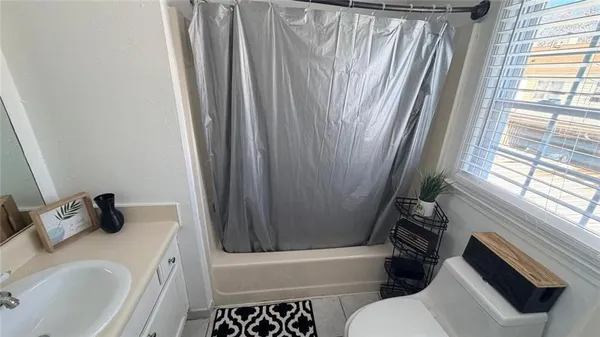 a bathroom with a sink toilet and tub