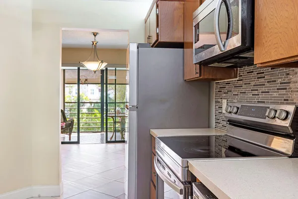 a kitchen that has a sink and a stove