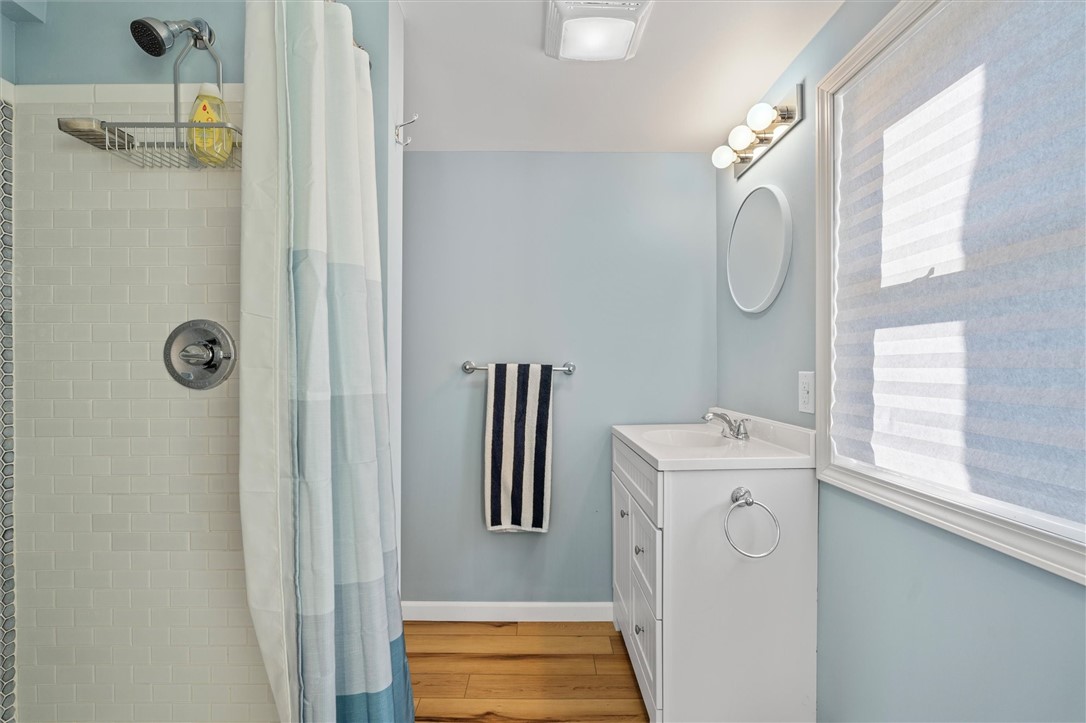81 North Rainbow Shores Road Sandy Creek, NY 13142 - Photo 27 of 50 Bathroom with window to view the lake
