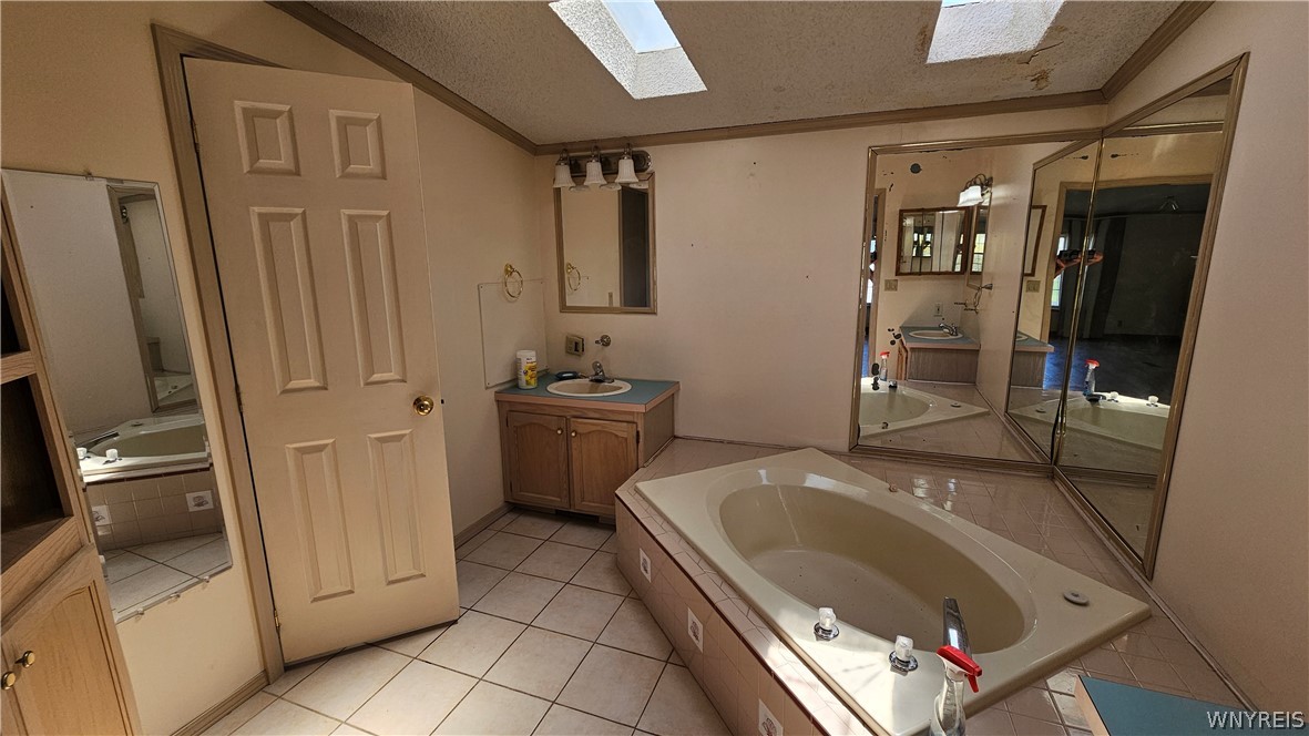 20 Calla Way Cheektowaga, NY 14043 - Photo 19 of 31 Master bathroom with skylights and soaking tub