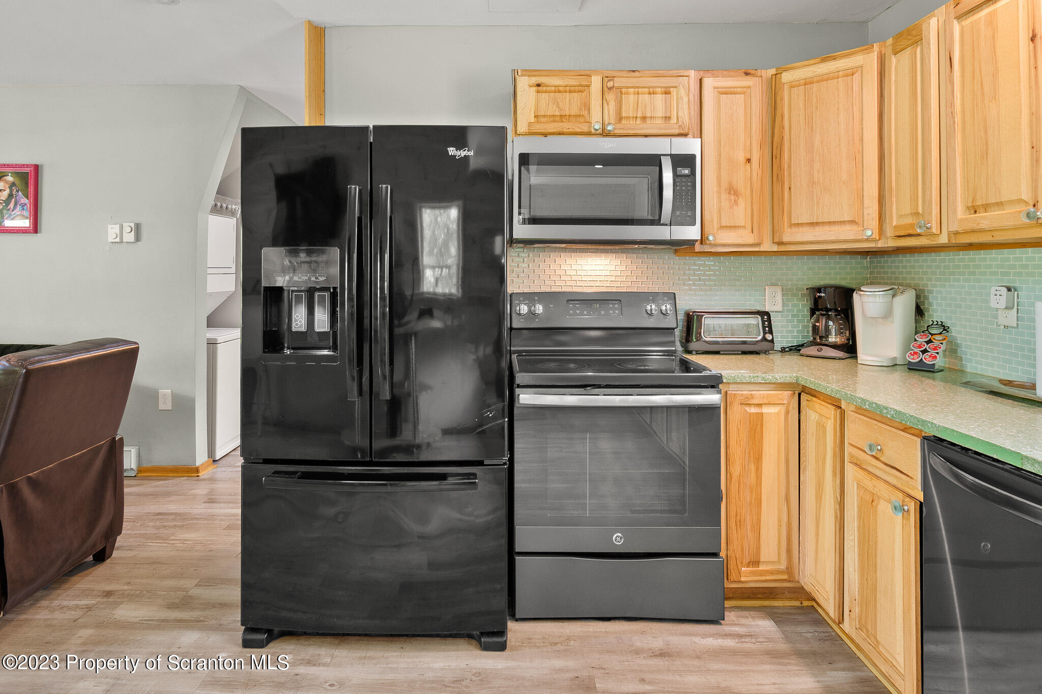 311 River Road Falls, PA 18615 - Photo 11 of 30 a kitchen with a refrigerator stove and microwave