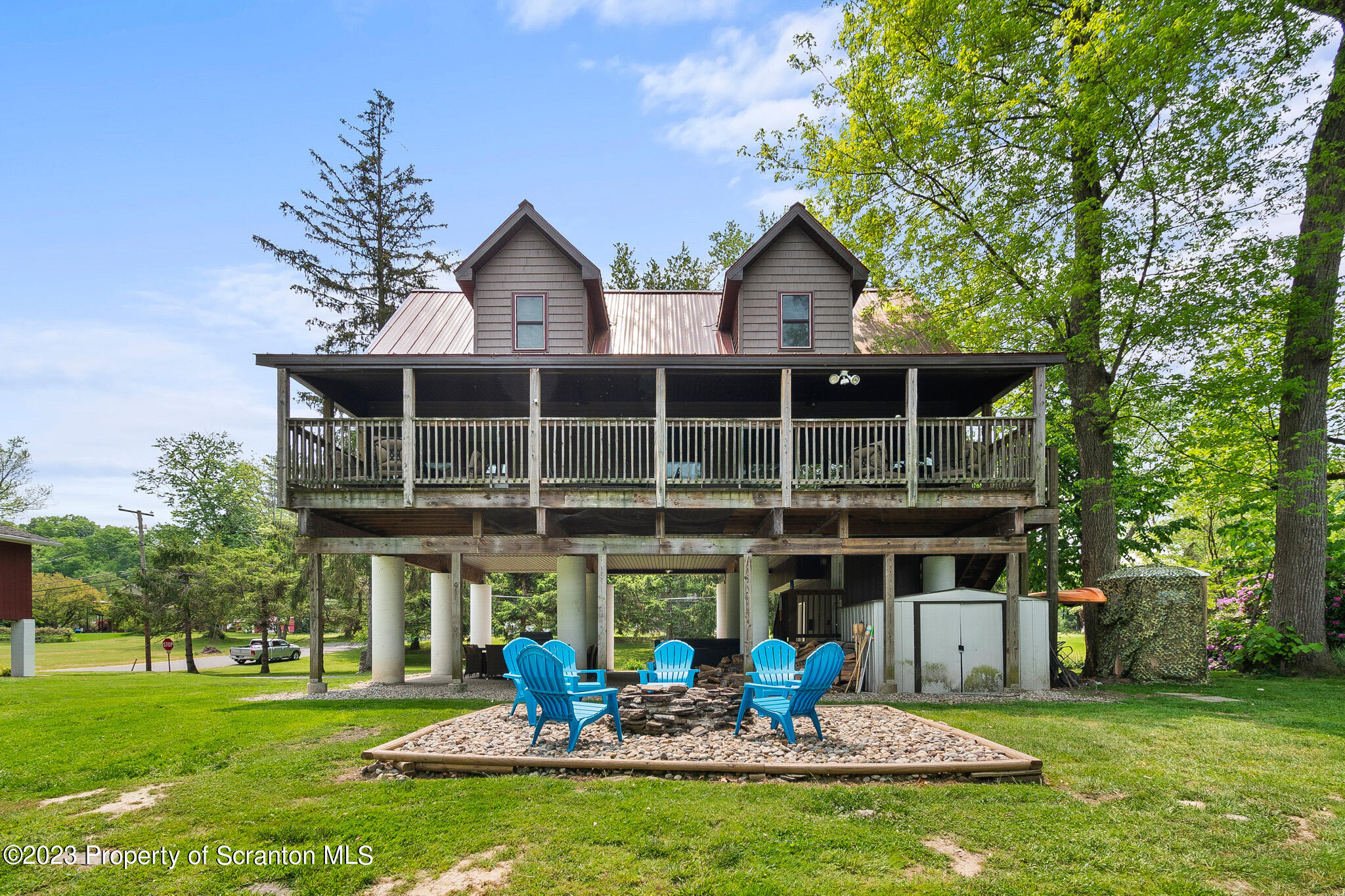 311 River Road Falls, PA 18615 - Photo 16 of 30 a front view of a house with a yard table and chairs