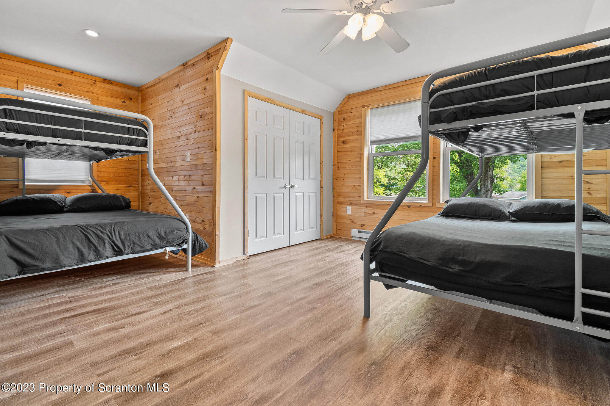 311 River Road Falls, PA 18615 - Photo 18 of 30 a bedroom with a bed and a walk in closet