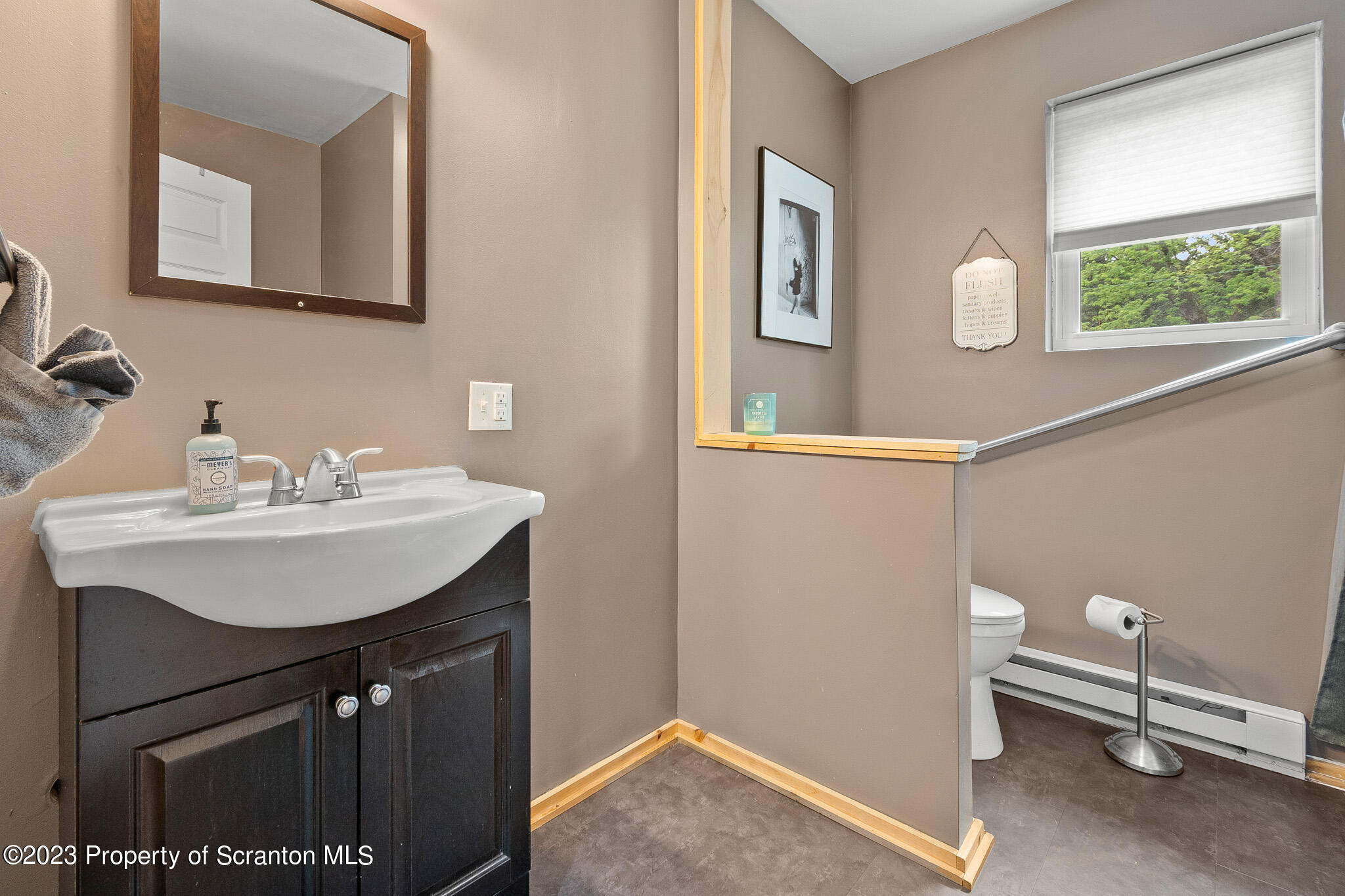 311 River Road Falls, PA 18615 - Photo 19 of 30 a bathroom with a sink vanity and a mirror
