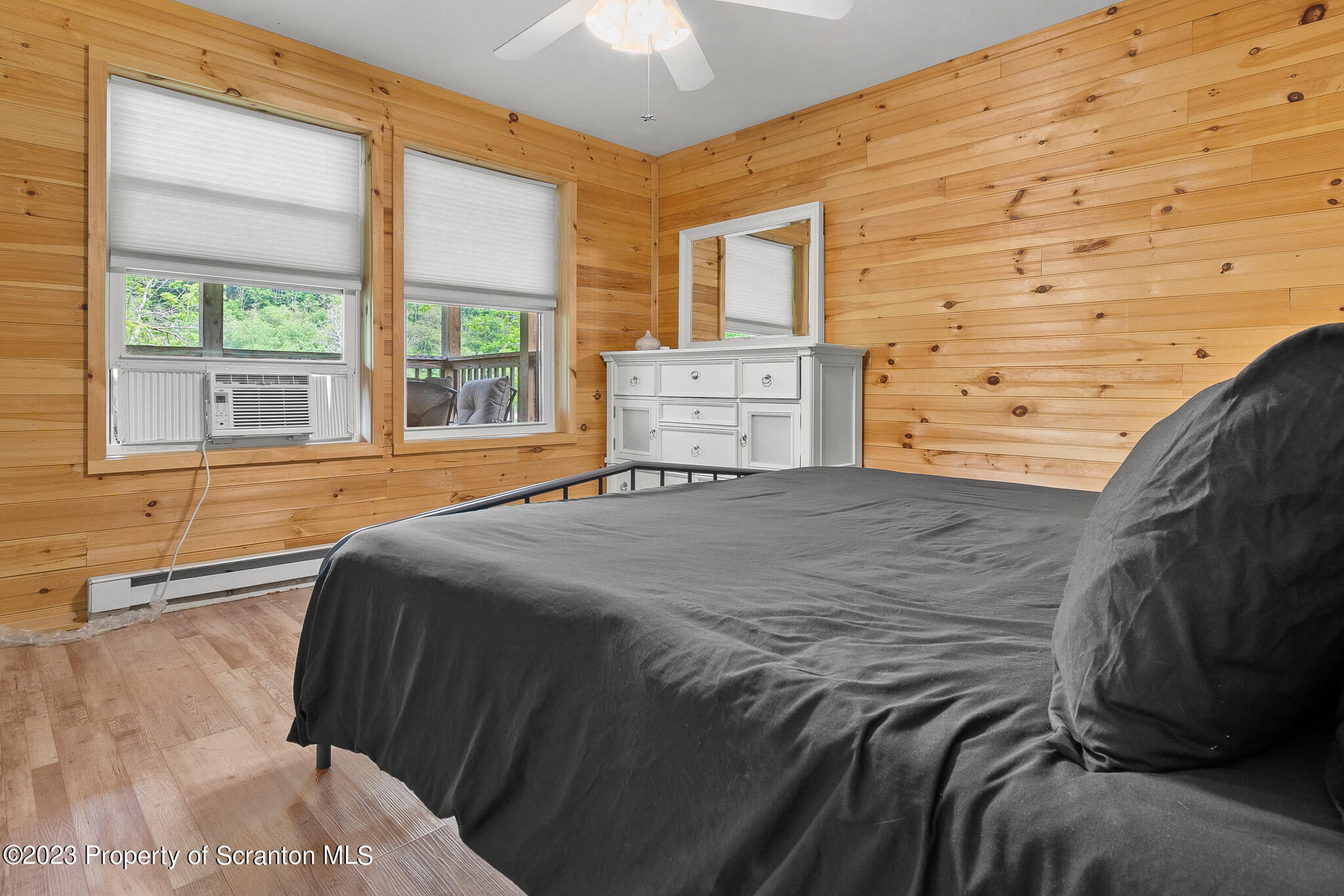 311 River Road Falls, PA 18615 - Photo 20 of 30 a bed sitting in a bedroom next to a window