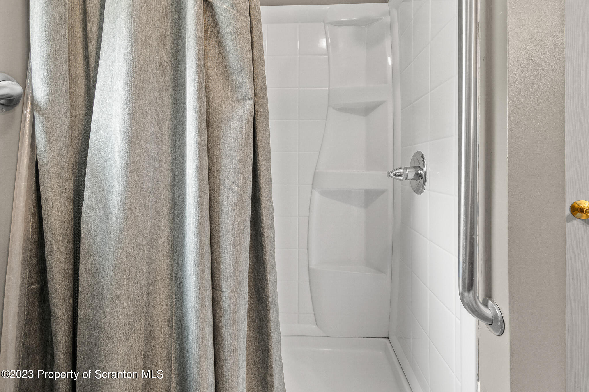 311 River Road Falls, PA 18615 - Photo 25 of 30 a bathroom with a glass shower door