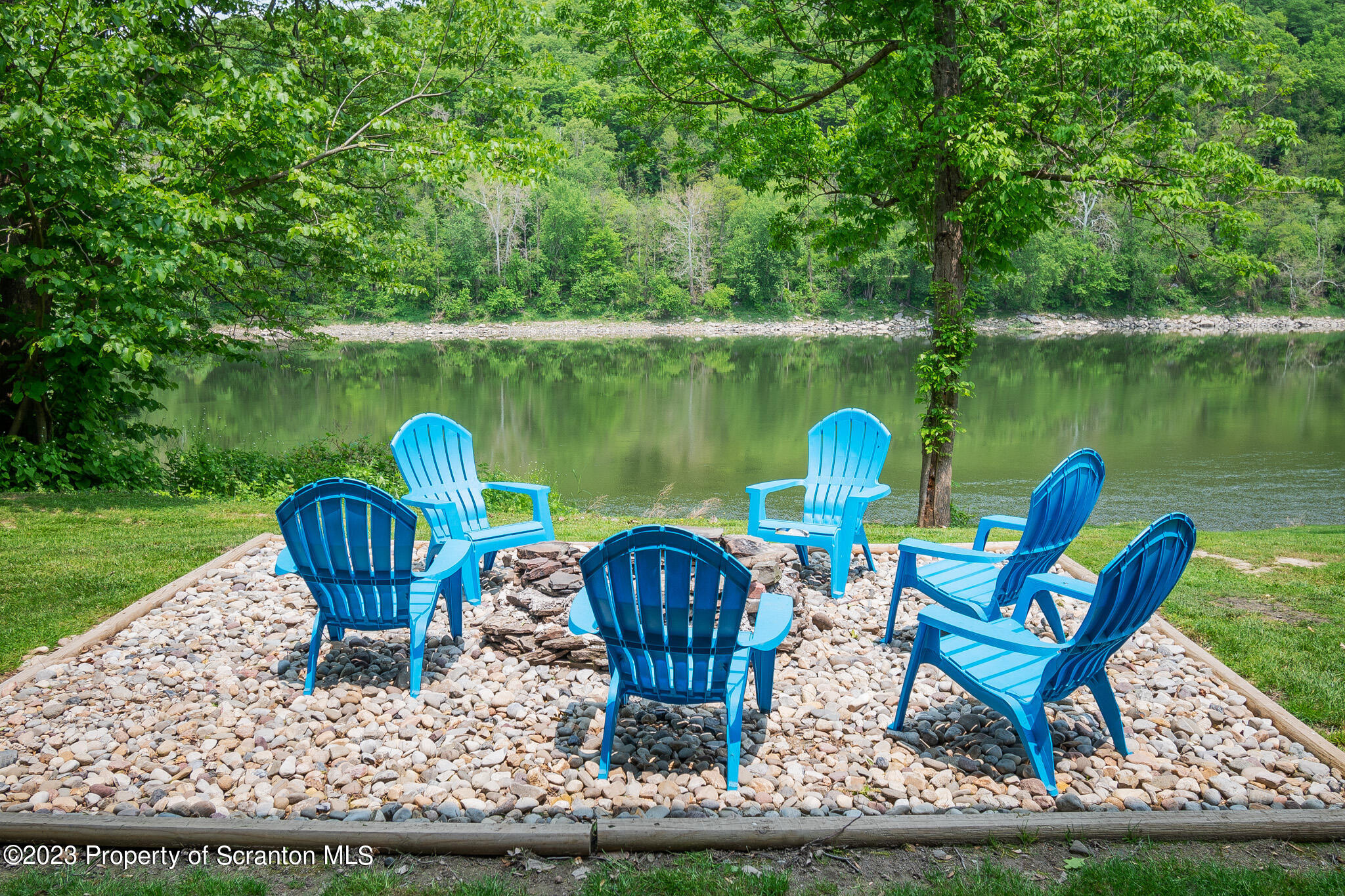 311 River Road Falls, PA 18615 - Photo 30 of 30 a swimming pool with outdoor seating and garden