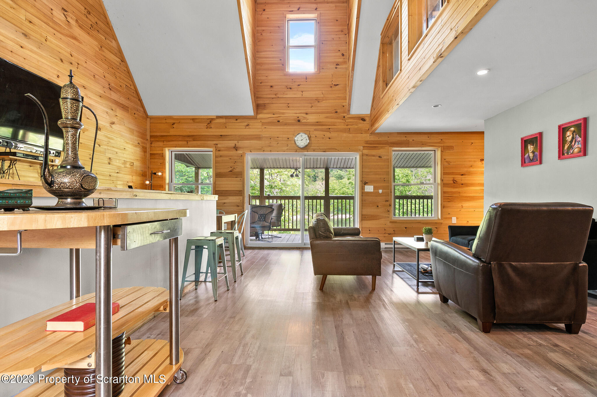 311 River Road Falls, PA 18615 - Photo 5 of 30 a living room with furniture wooden floor and a floor to ceiling window