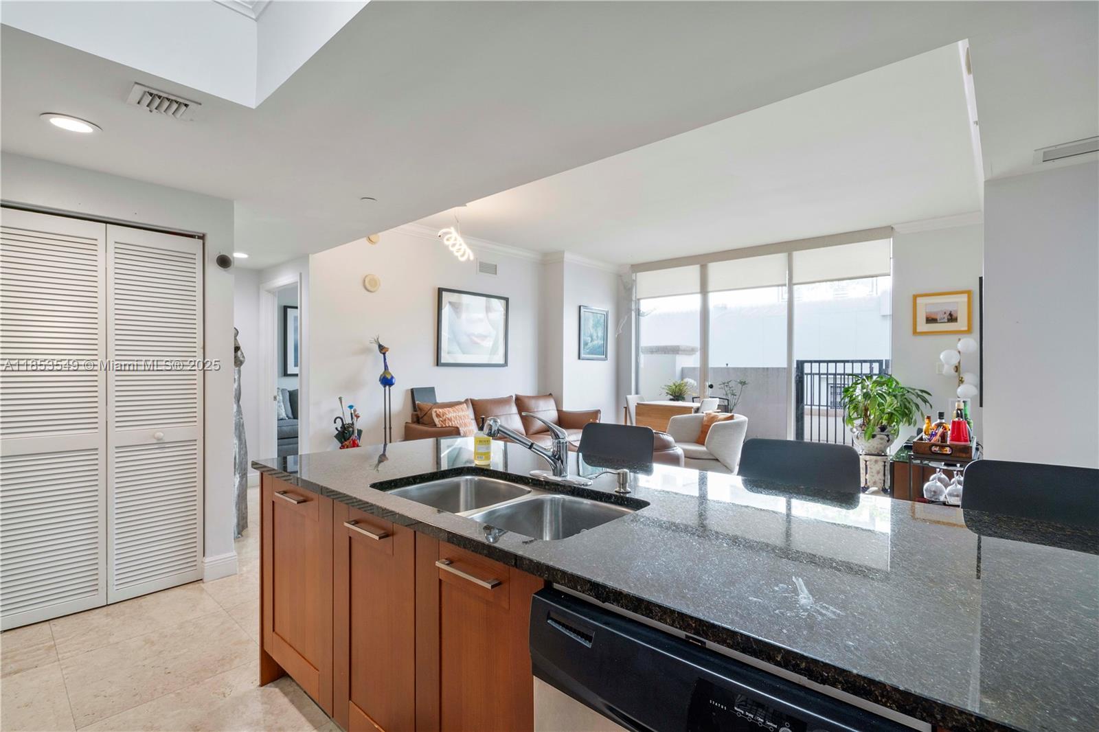 4100 Salzedo Street, Unit 409 Coral Gables, FL 33146 - Photo 16 of 45 a view of a kitchen and living room