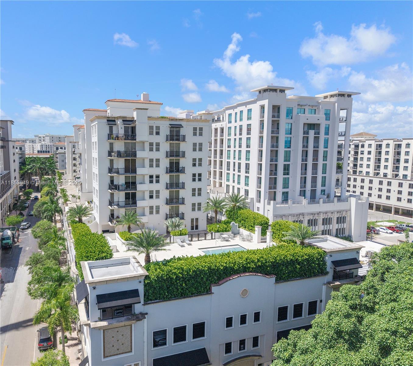 4100 Salzedo Street, Unit 409 Coral Gables, FL 33146 - Photo 2 of 45 a view of buildings with a yard