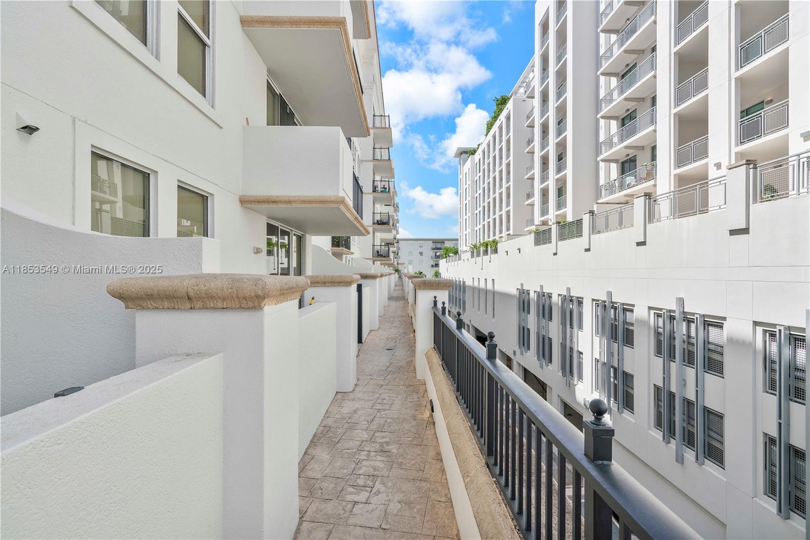 4100 Salzedo Street, Unit 409 Coral Gables, FL 33146 - Photo 26 of 45 a view of a balcony with an outdoor and sitting area