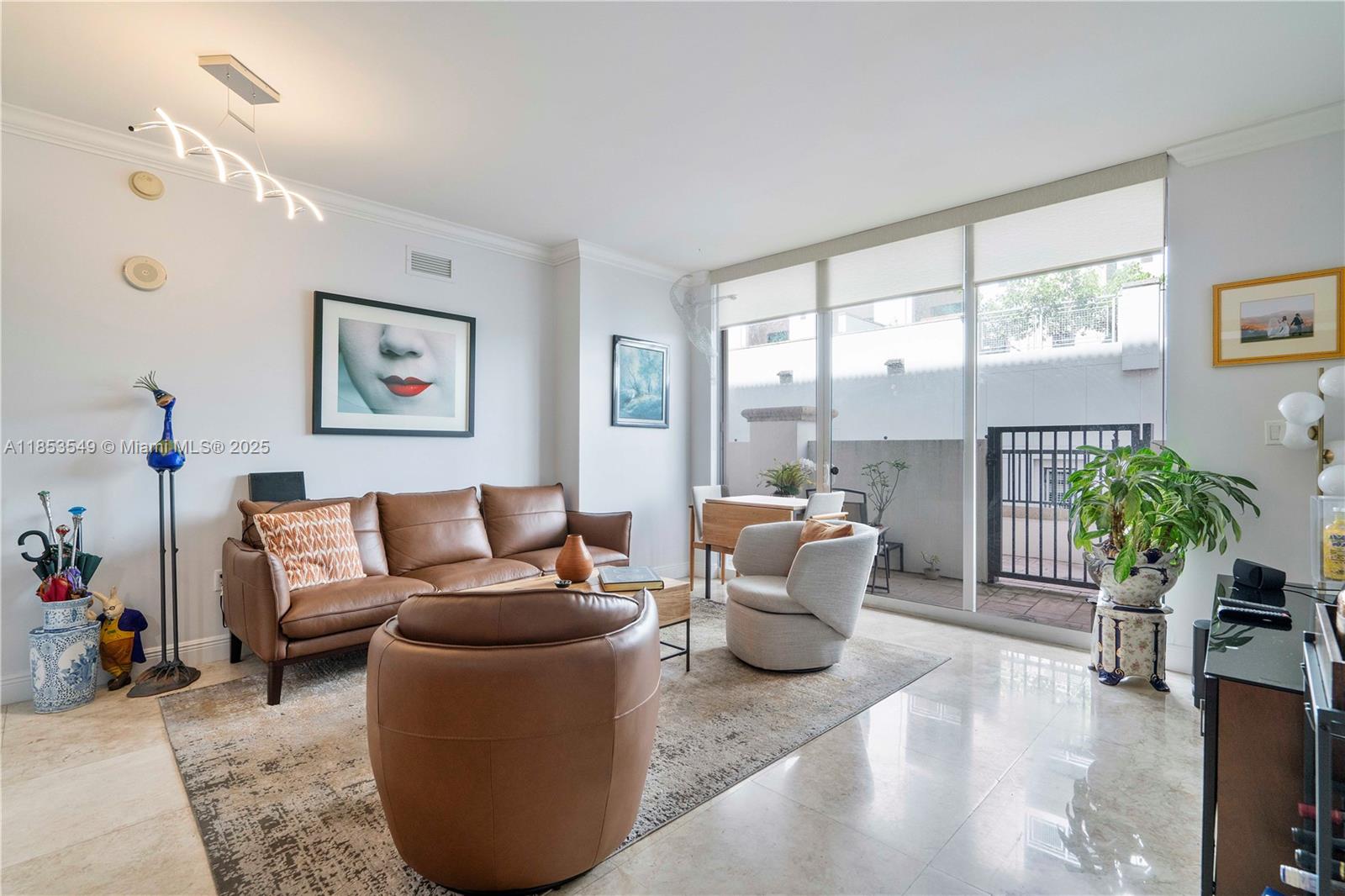 4100 Salzedo Street, Unit 409 Coral Gables, FL 33146 - Photo 3 of 45 a living room with furniture and a large window