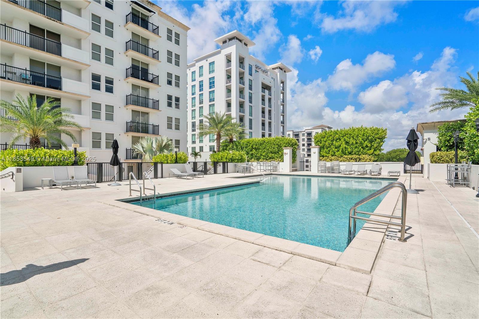 4100 Salzedo Street, Unit 409 Coral Gables, FL 33146 - Photo 31 of 45 a view of a swimming pool with a patio