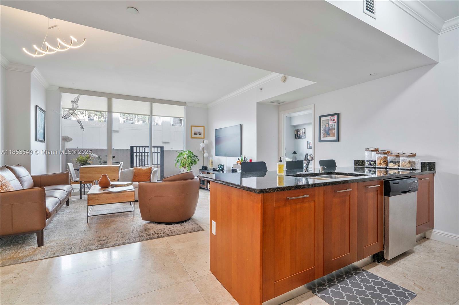 4100 Salzedo Street, Unit 409 Coral Gables, FL 33146 - Photo 4 of 45 a living room with furniture and a large window