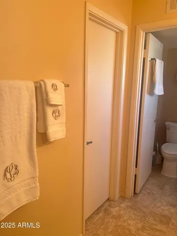 a bedroom with bed and lamp