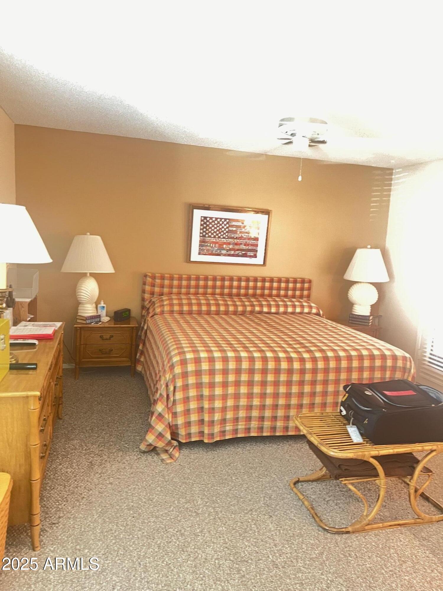 5518 East Lindstrom Lane, Unit 1044 Mesa, AZ 85215 - Photo 20 of 30 a bedroom with bed and lamp