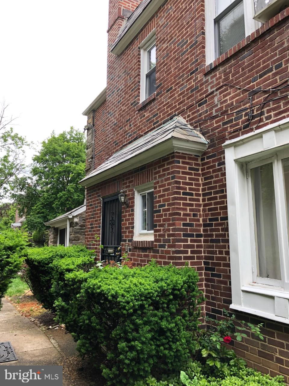 5706 Drexel Road Philadelphia, PA 19131 - Photo 3 of 20 Brick side wall of home