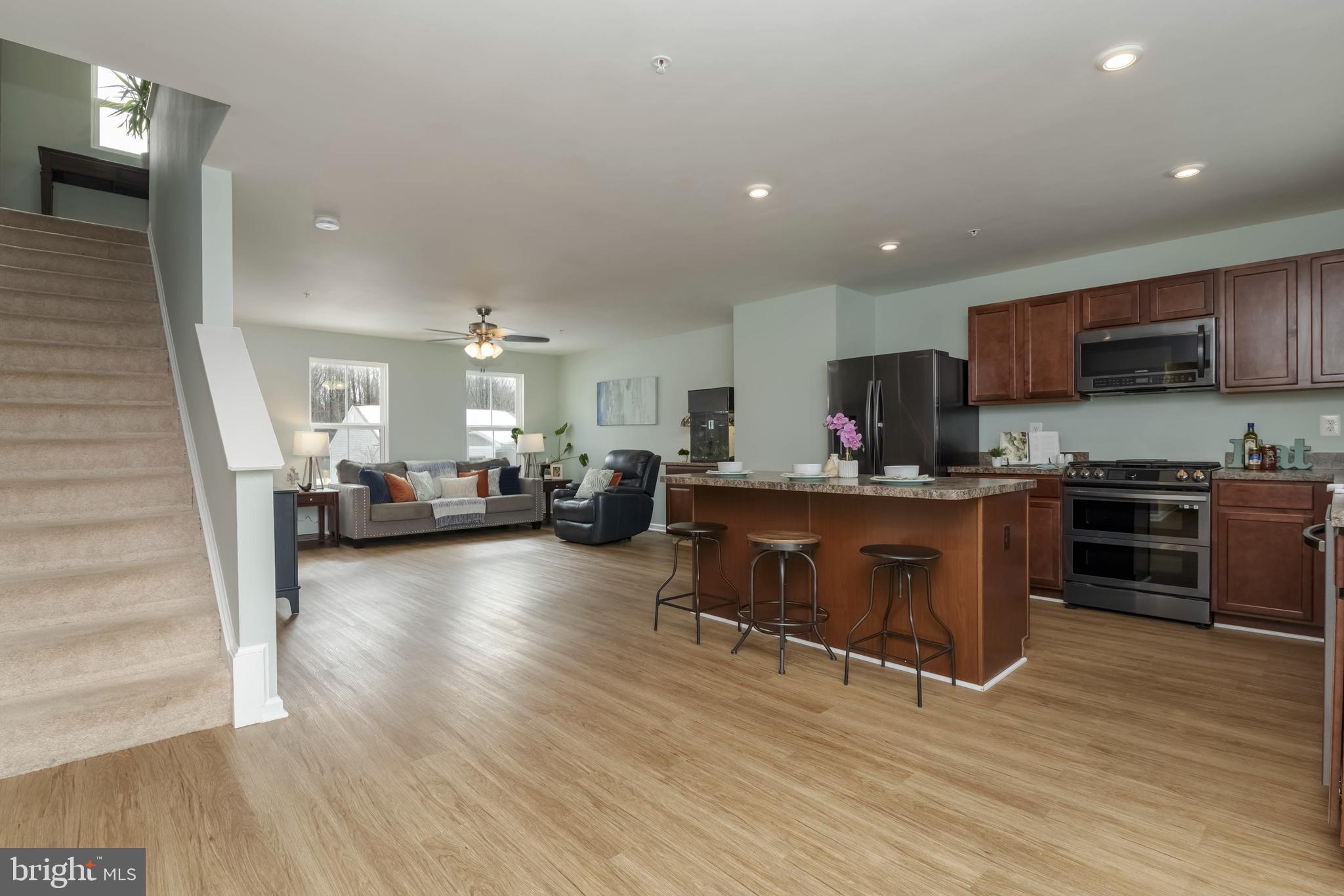 10114 Blansford Way Middle River, MD 21220 - Photo 11 of 41 a kitchen with sink cabinets and wooden floor