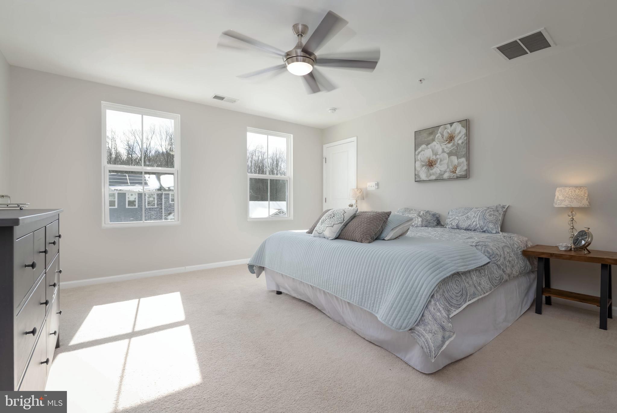 10114 Blansford Way Middle River, MD 21220 - Photo 18 of 41 a spacious bedroom with a bed and a large window