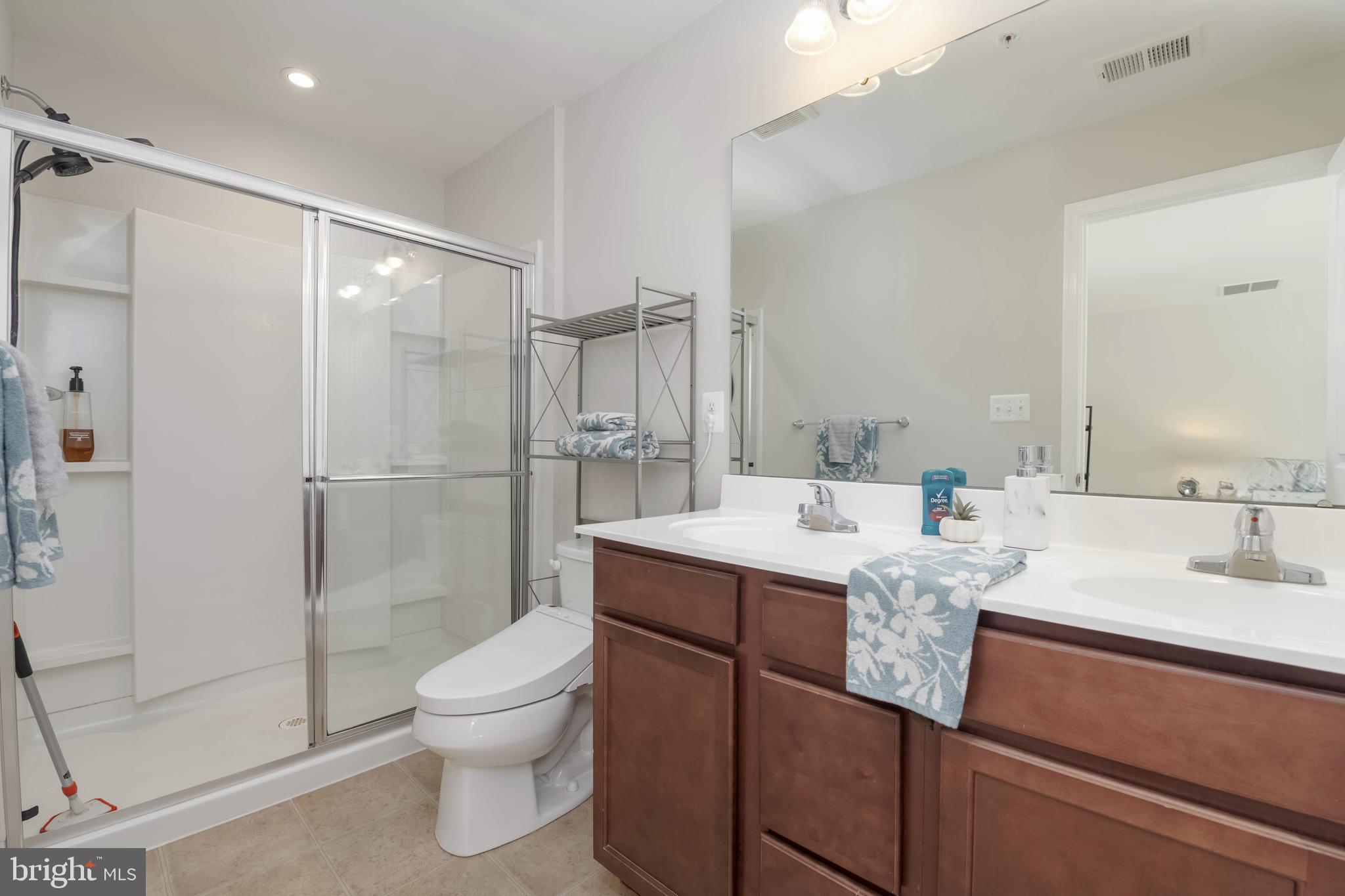 10114 Blansford Way Middle River, MD 21220 - Photo 19 of 41 a bathroom with a bathtub shower sink mirror and toilet