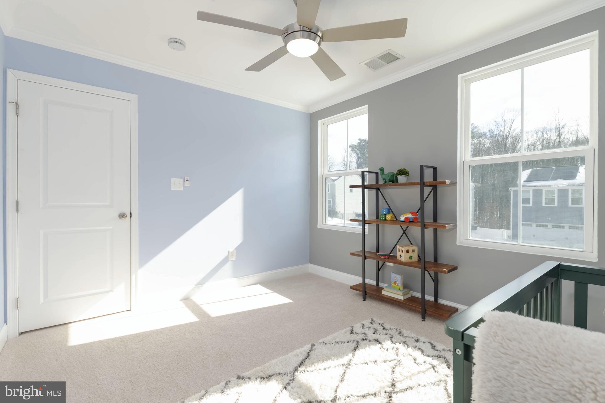 10114 Blansford Way Middle River, MD 21220 - Photo 22 of 41 a view of a livingroom with furniture and a ceiling fan