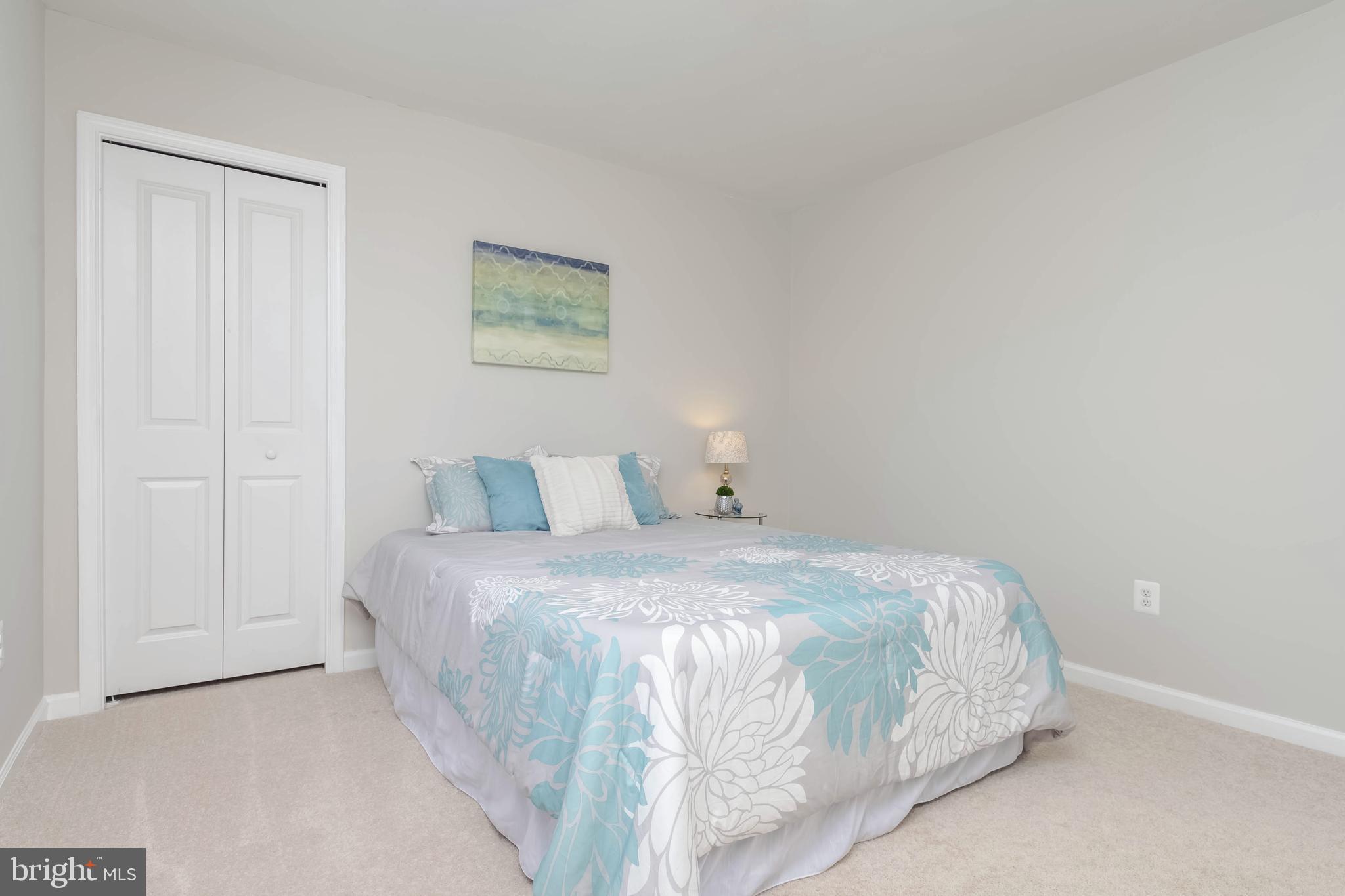 10114 Blansford Way Middle River, MD 21220 - Photo 24 of 41 a bedroom with a bed and a wall painting