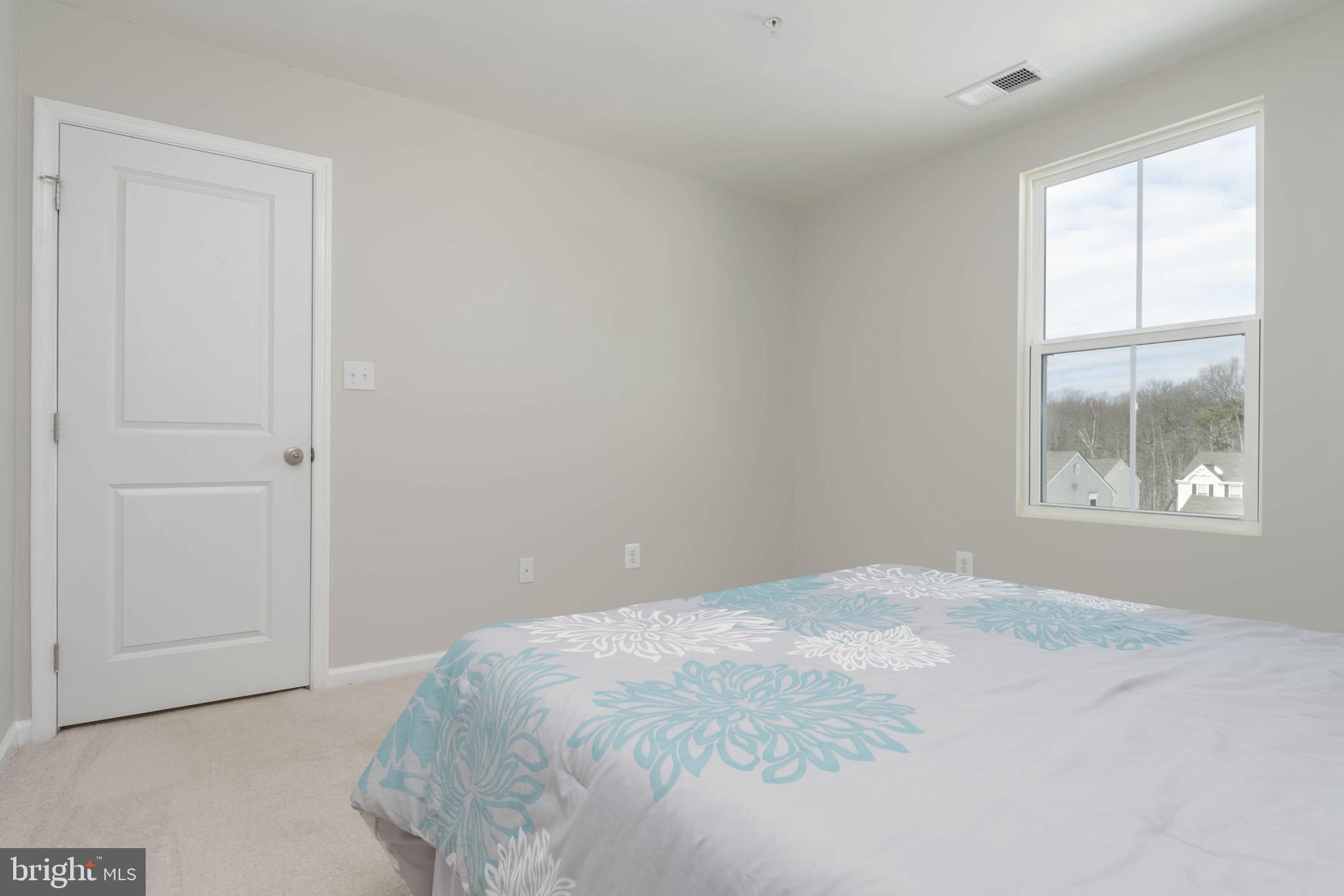 10114 Blansford Way Middle River, MD 21220 - Photo 25 of 41 a bedroom with a bed and a window