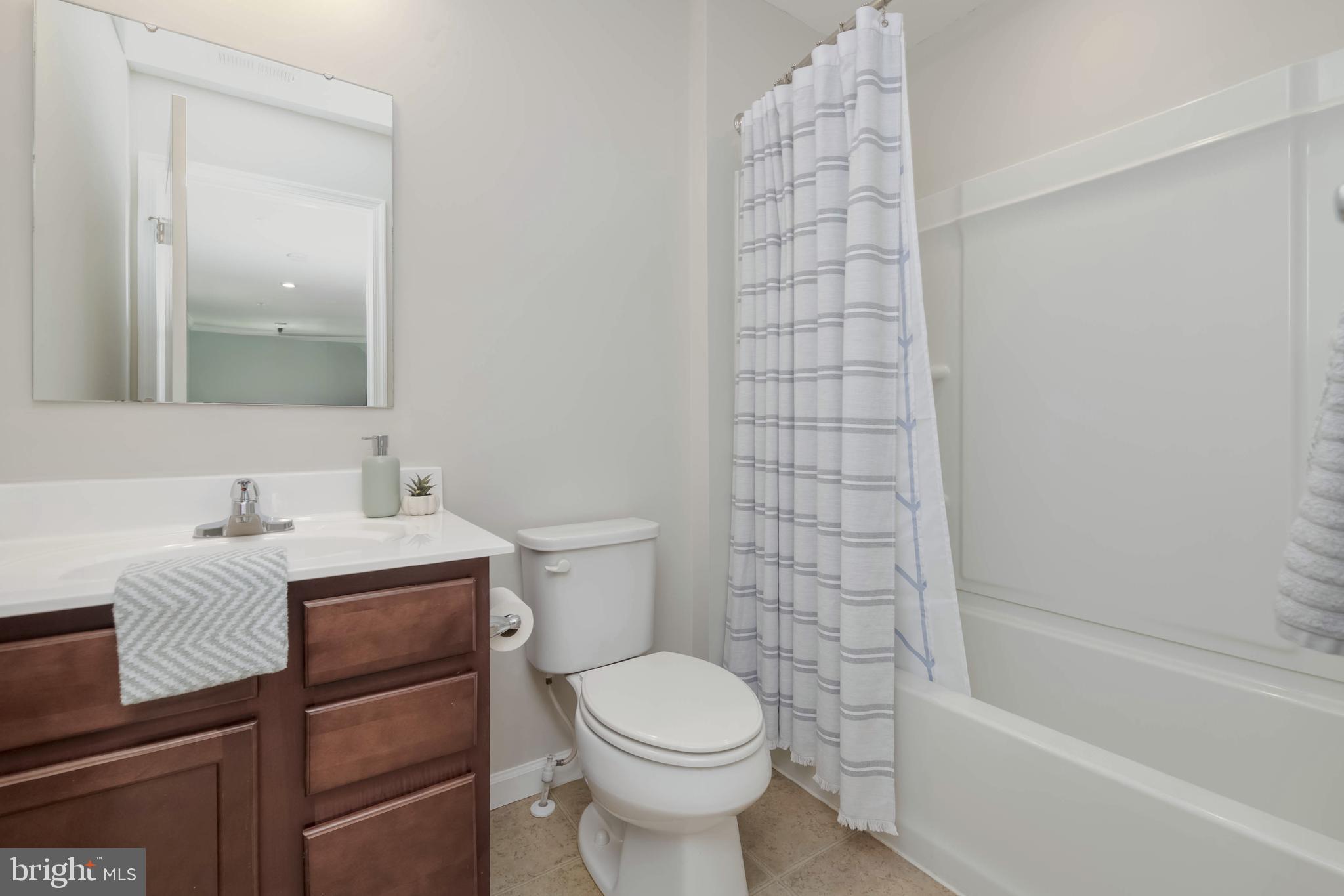 10114 Blansford Way Middle River, MD 21220 - Photo 29 of 41 a bathroom with a sink toilet and shower