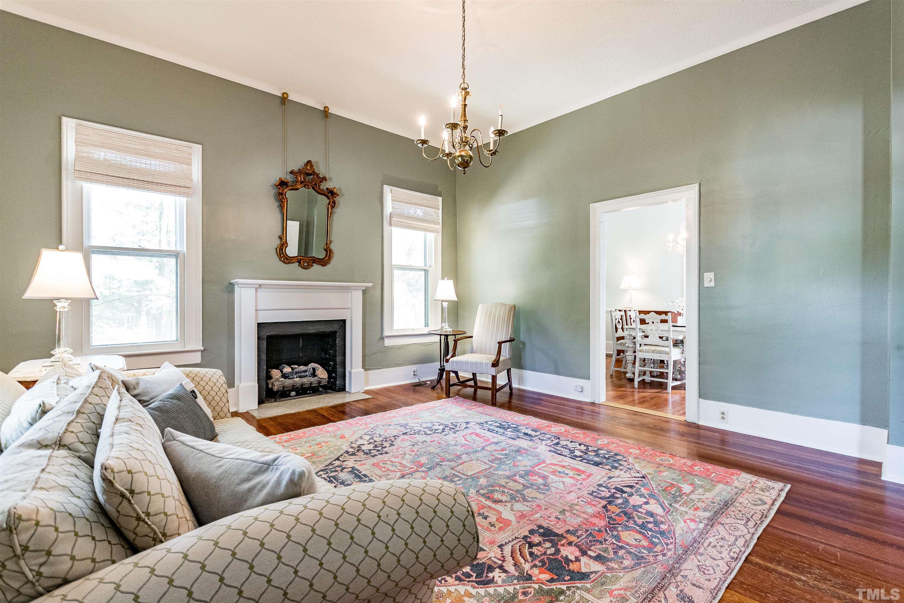 6467 Cleveland Road Clayton, NC 27520 - Photo 12 of 54 With soaring windows, Heart of Pine Floors and entry to the dining room.