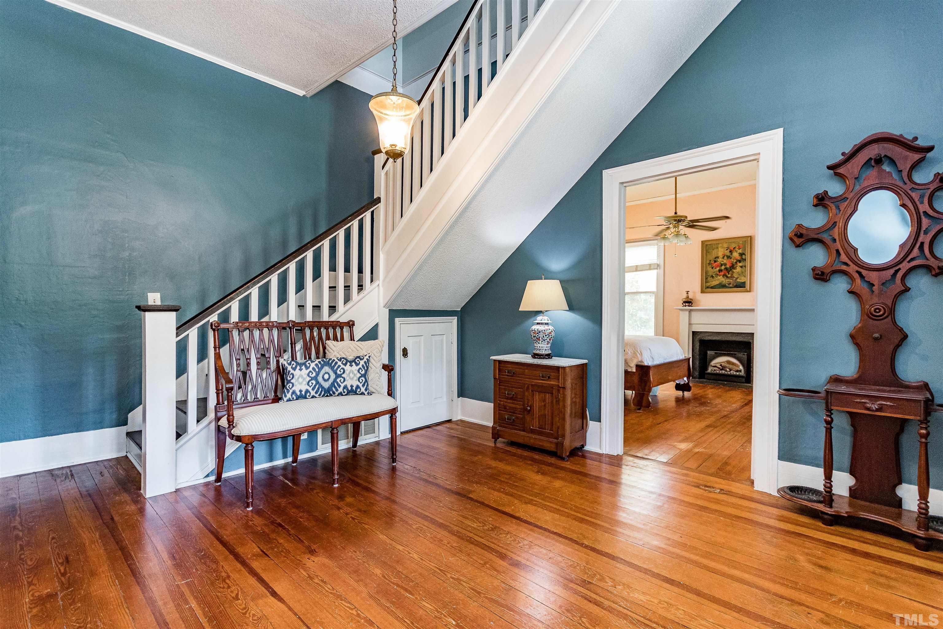 6467 Cleveland Road Clayton, NC 27520 - Photo 6 of 54 To the right, entry to the first floor bedroom with a fireplace.