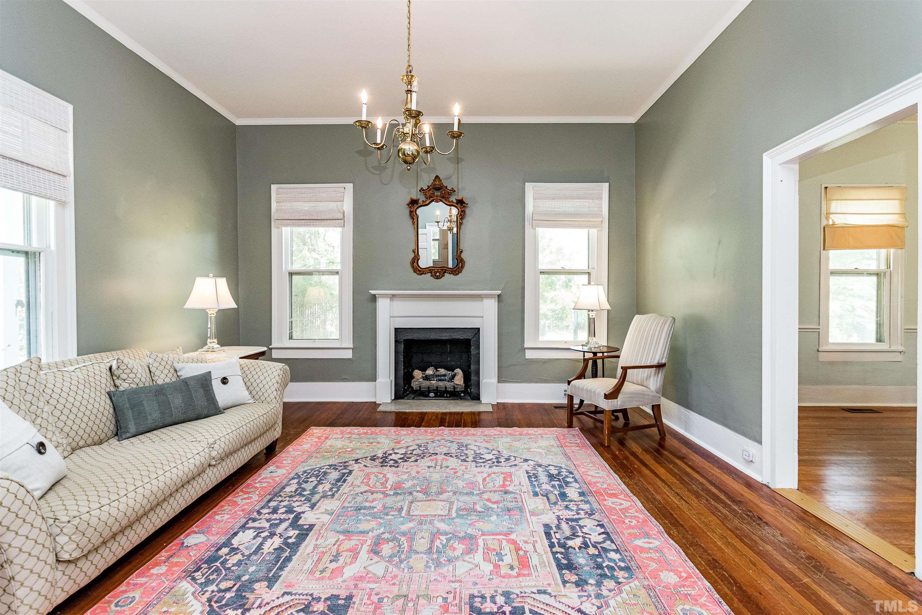 6467 Cleveland Road Clayton, NC 27520 - Photo 10 of 54 With soaring windows, Heart of Pine Floors and entry to the dining room.
