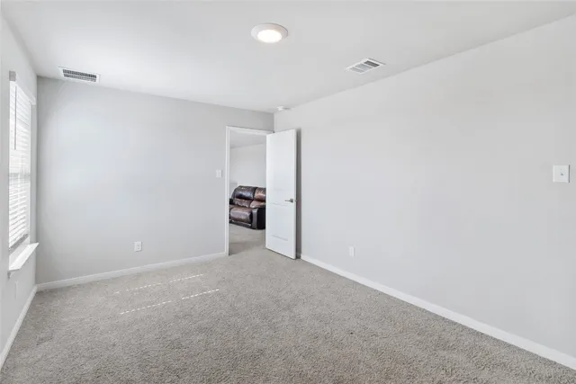 a view of a livingroom with closet and storage