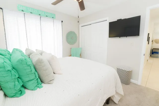 a bathroom with a sink a toilet and shower curtain