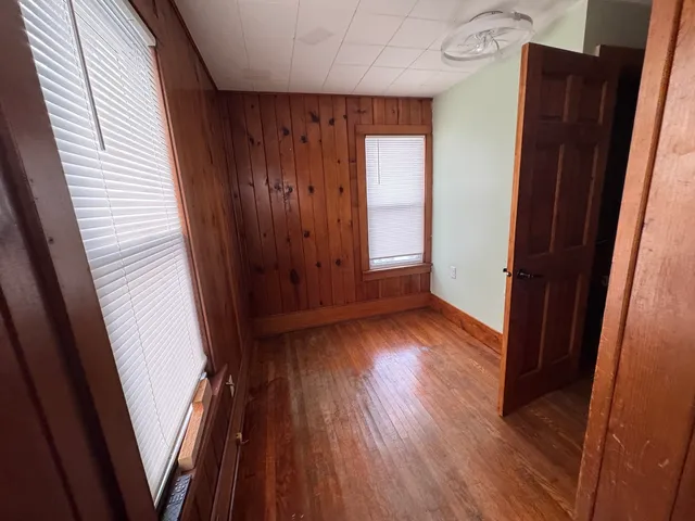 a view of front door with wooden floor