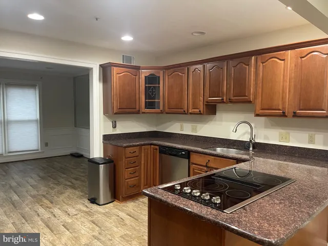 a bathroom with a tub and a window