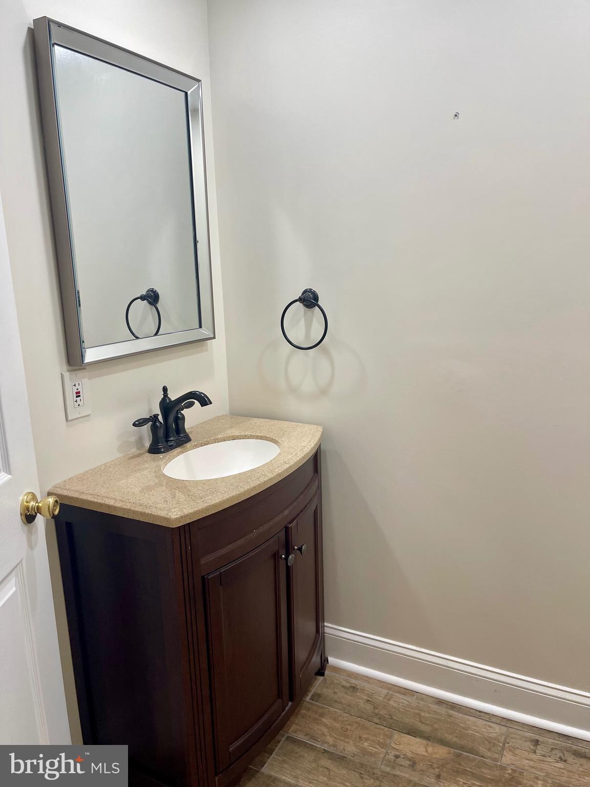 11803 Bishops Content Road Bowie, MD 20721 - Photo 20 of 54 a bathroom with a sink and a mirror