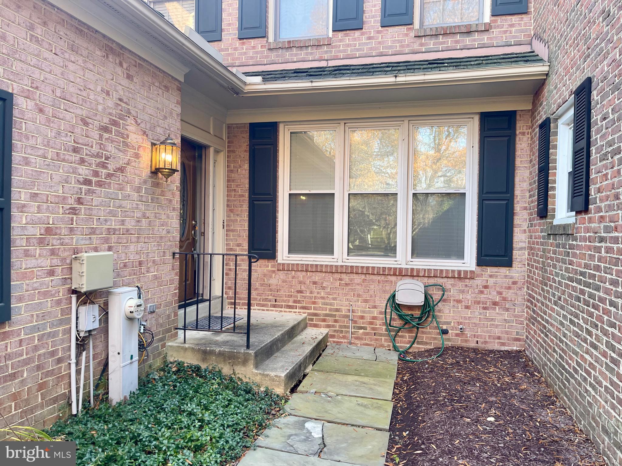 11803 Bishops Content Road Bowie, MD 20721 - Photo 2 of 54 a front view of a house with a garden