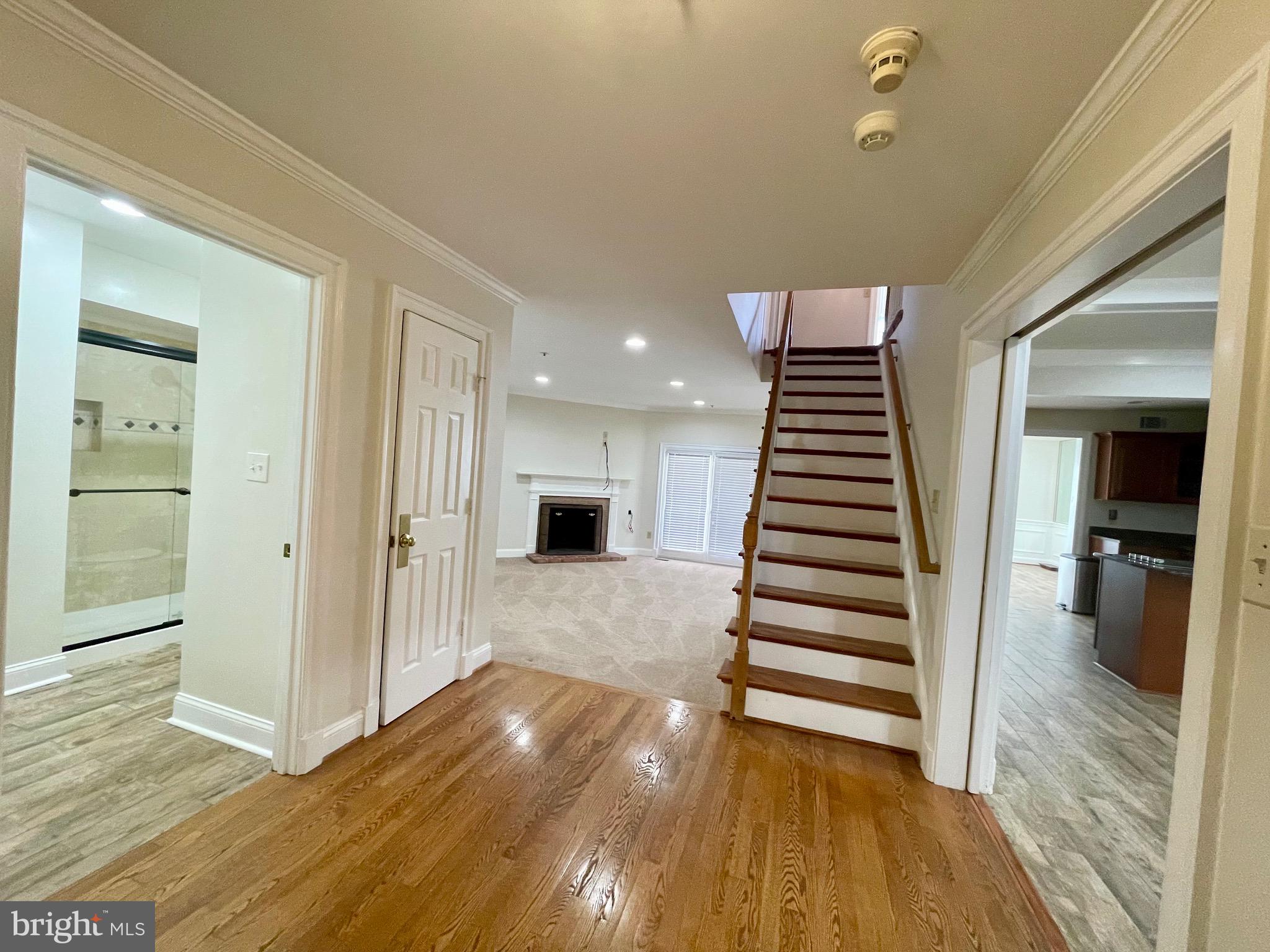 11803 Bishops Content Road Bowie, MD 20721 - Photo 3 of 54 a view of a room with wooden floor and stairs