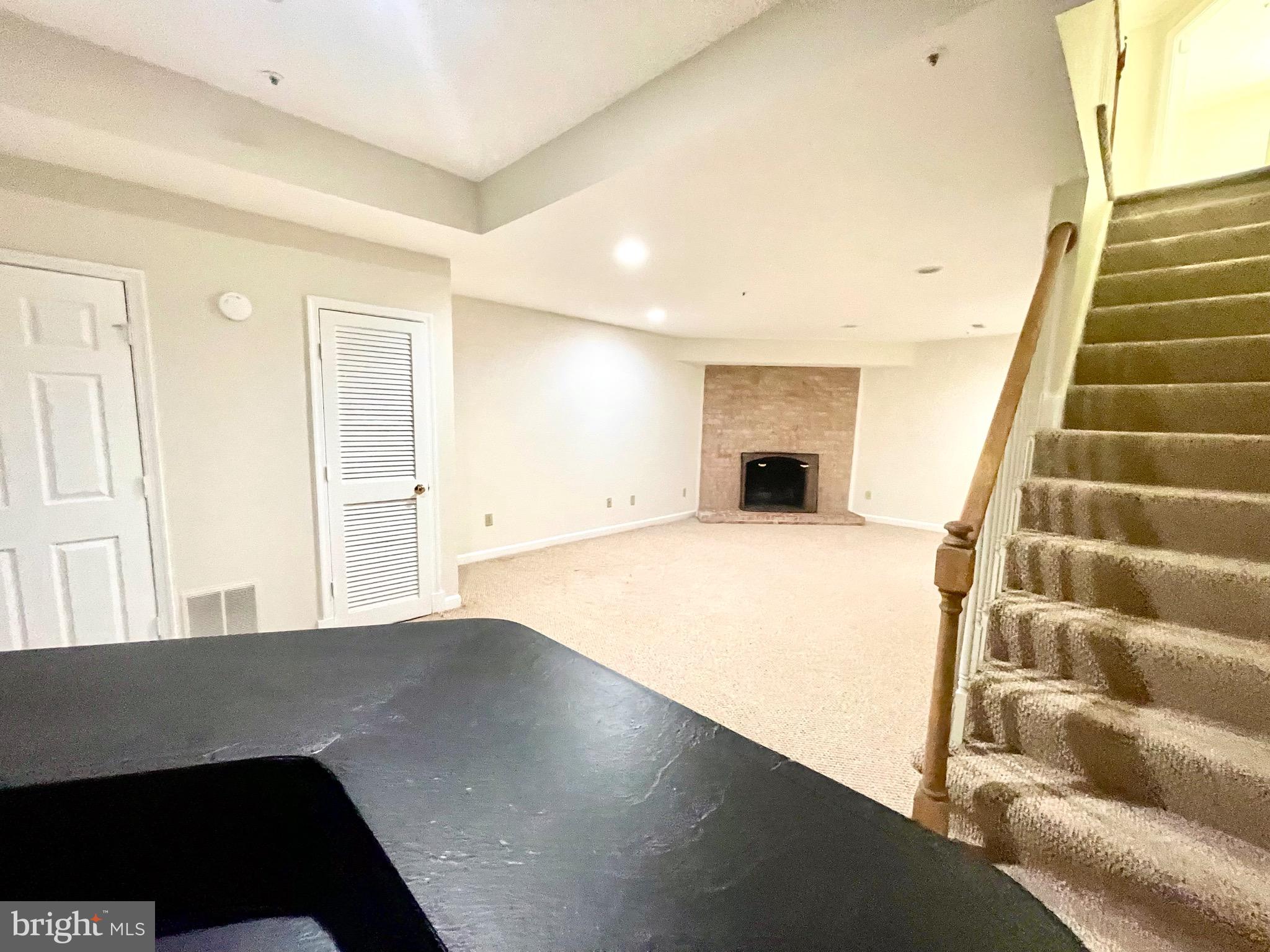 11803 Bishops Content Road Bowie, MD 20721 - Photo 42 of 54 a view of an empty room with stairs