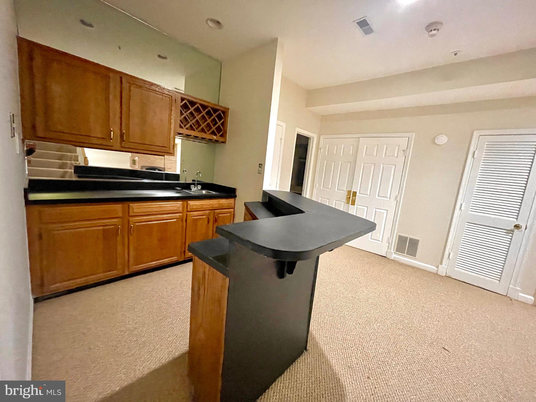 11803 Bishops Content Road Bowie, MD 20721 - Photo 43 of 54 a kitchen with stainless steel appliances granite countertop a stove a sink dishwasher and a refrigerator