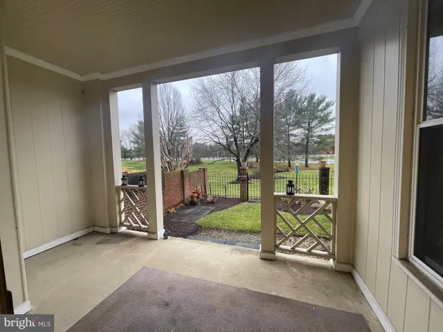 a kitchen with granite countertop a refrigerator and a stove top oven