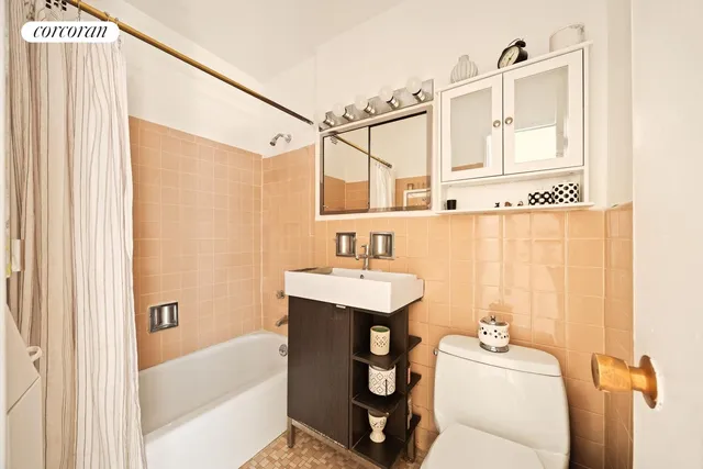 a bedroom with a bed and a large window with the outer view